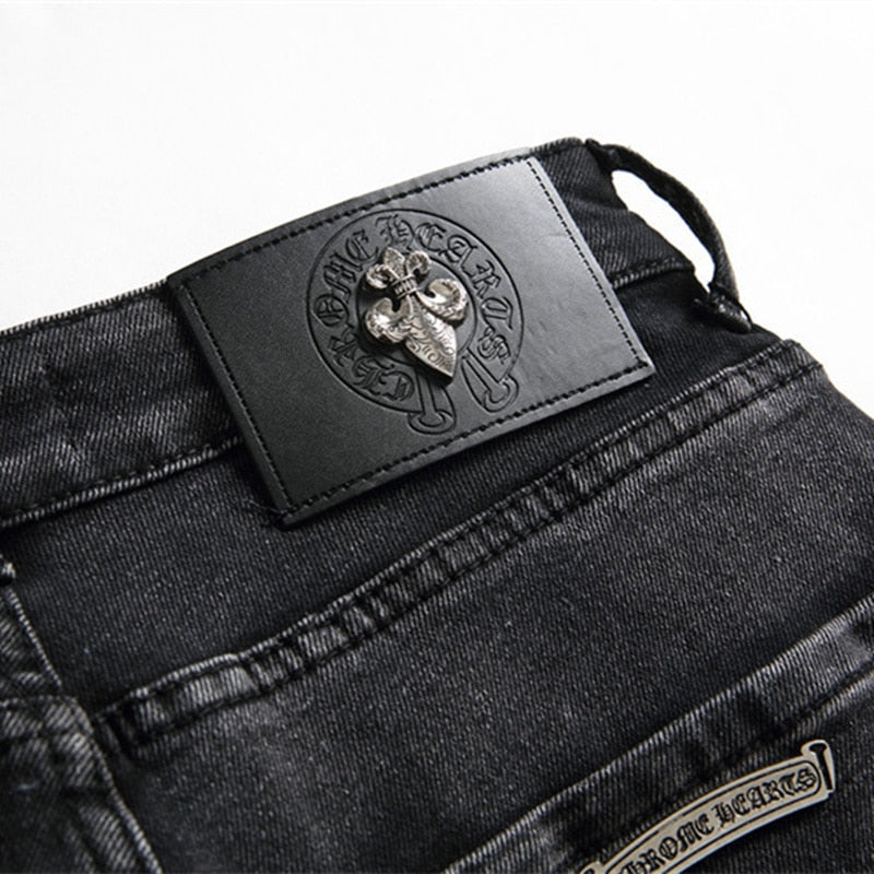 Embroidered Cross Emblem Tencel Jeans